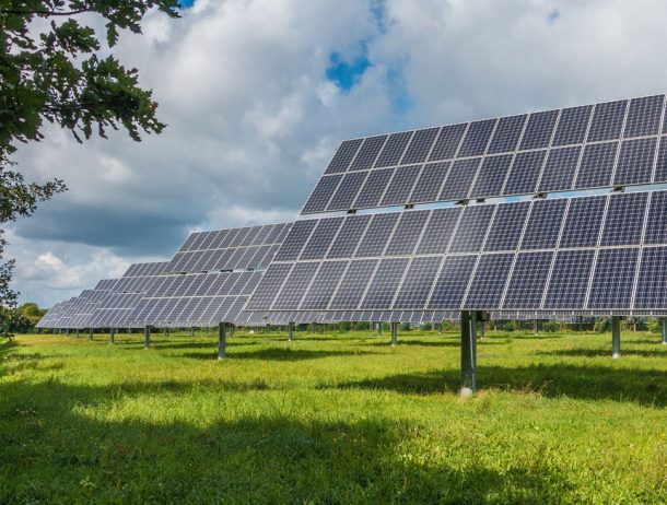 Solar photovoltaic panels supporting predictive analytics to improve renewable energy infrastructure efficiency.